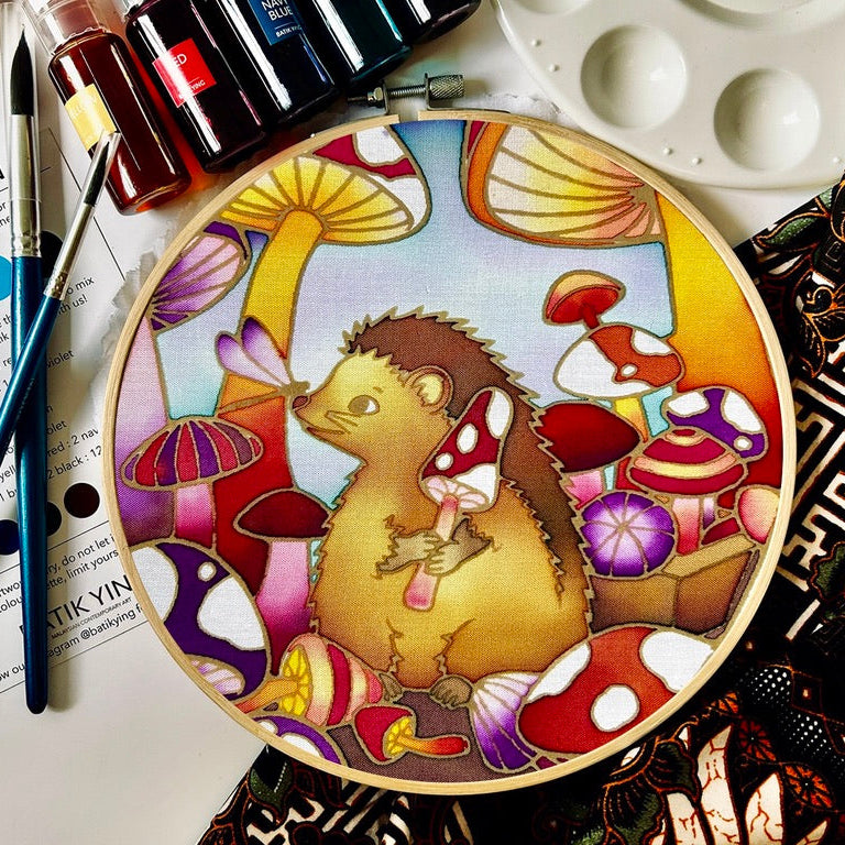 Down the Mushroom Hole batik craft kit by Batik Ying – finished hand-painted hedgehog and mushroom design in wooden ring