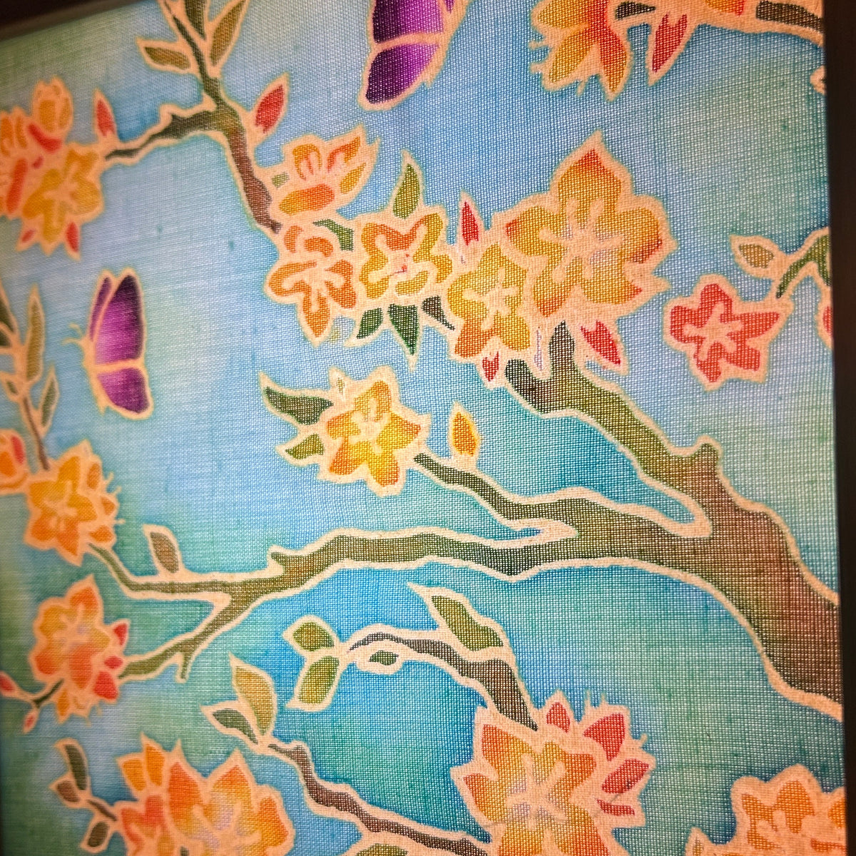 Batik Lamp Kit — Almond Blossom. Unlit batik cotton panel showing the hand-waxed almond blossom branches and purple beetles in teal, inspired by Van Gogh. By Batik Ying.