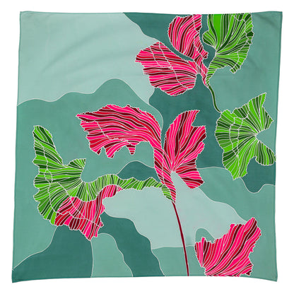 Batik satin cotton scarf by Batik Ying with green and pink floral patterns on blue background